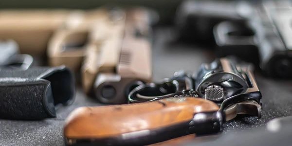 close up image of proper handling of firearms - Focal Pointe LLC