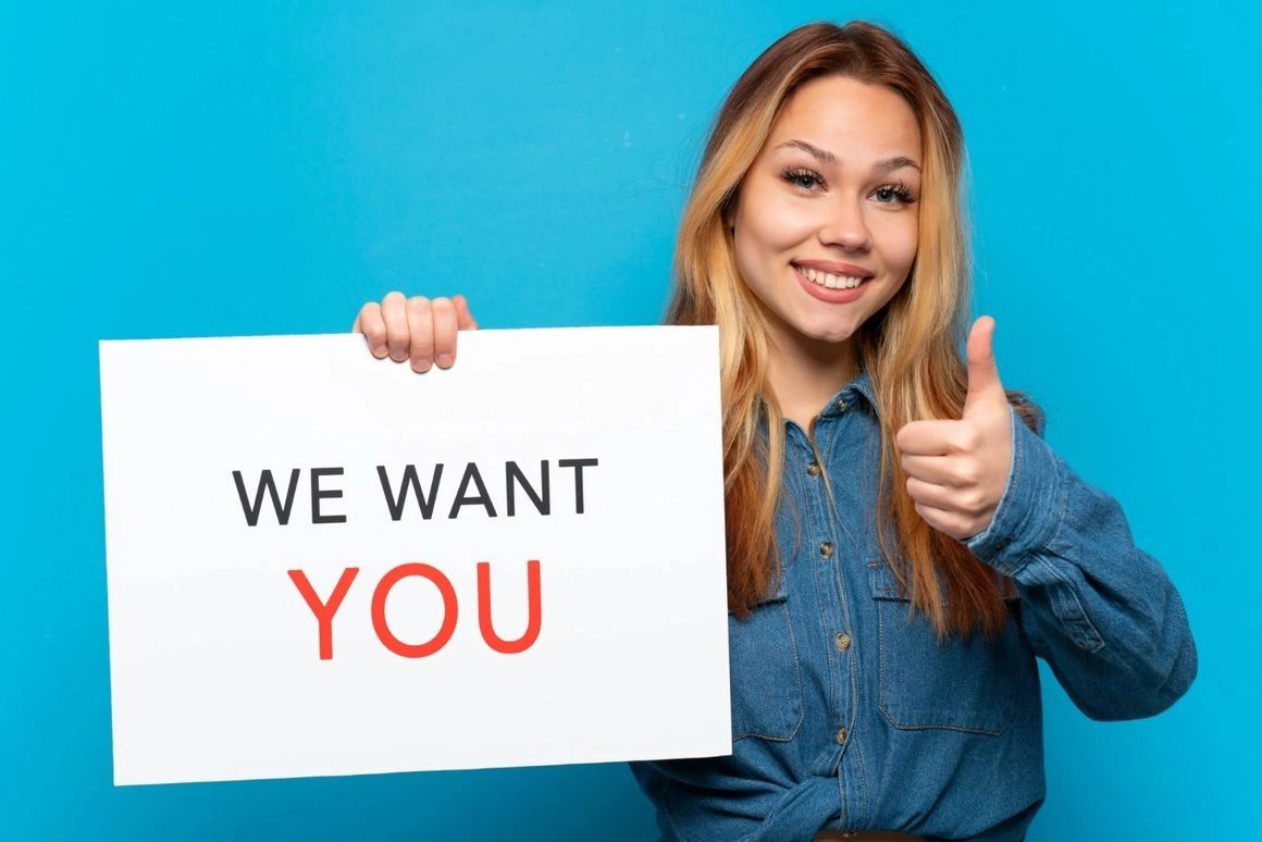 Woman holding sign and encouraging application for work from home opportunity