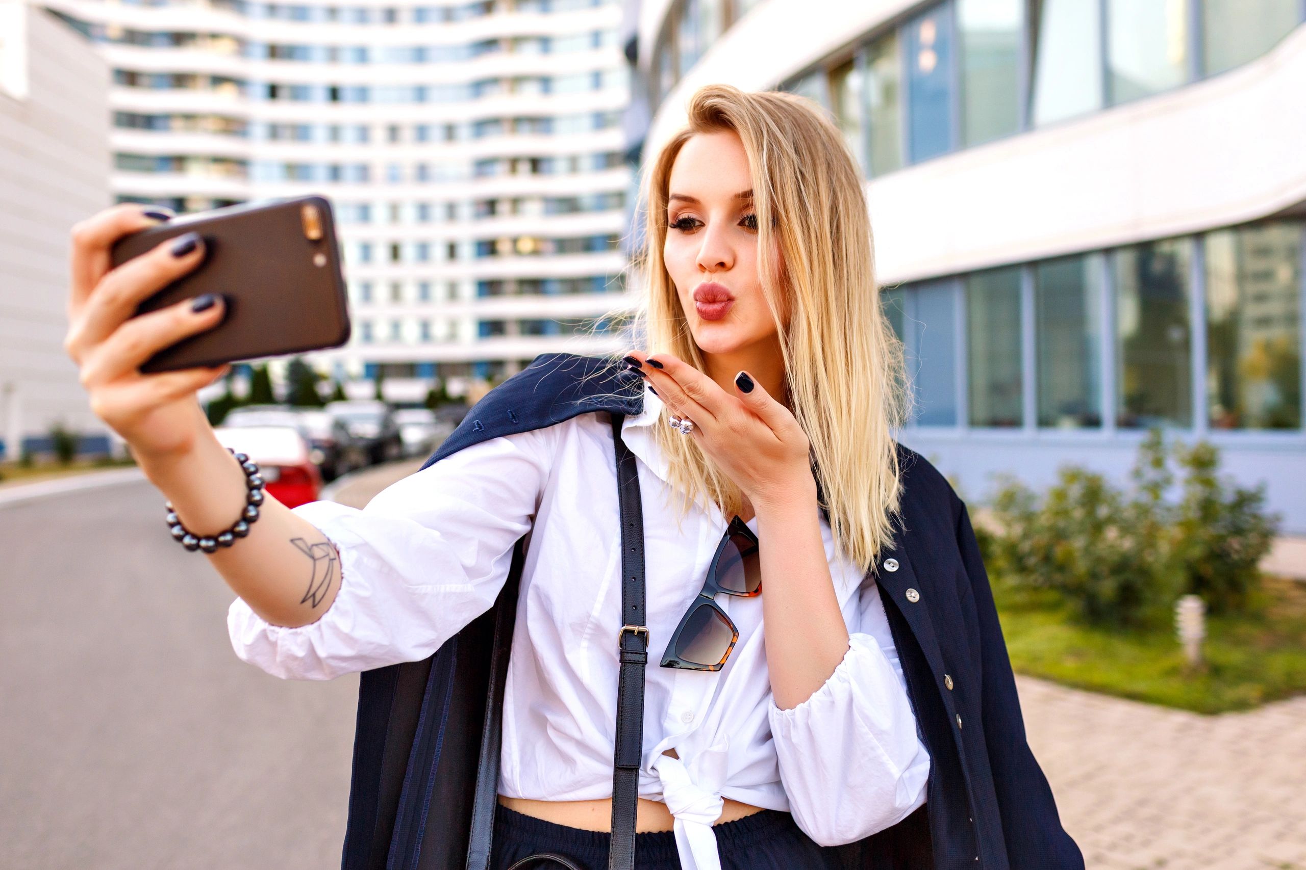 Woman creating content on phone for work from home opportunities