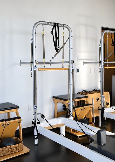 Pilates reformer machine in a fitness studio.