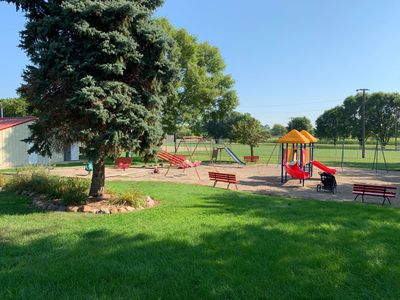 Alvord City park with swing set, slides, baseball diamond, frisbee golf and basketball court.