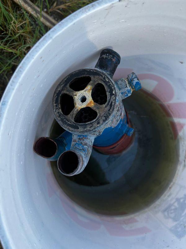Soaking Heat Exchanger in Barnacle Buster