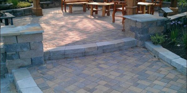 Paver patios with retaining wall and columns