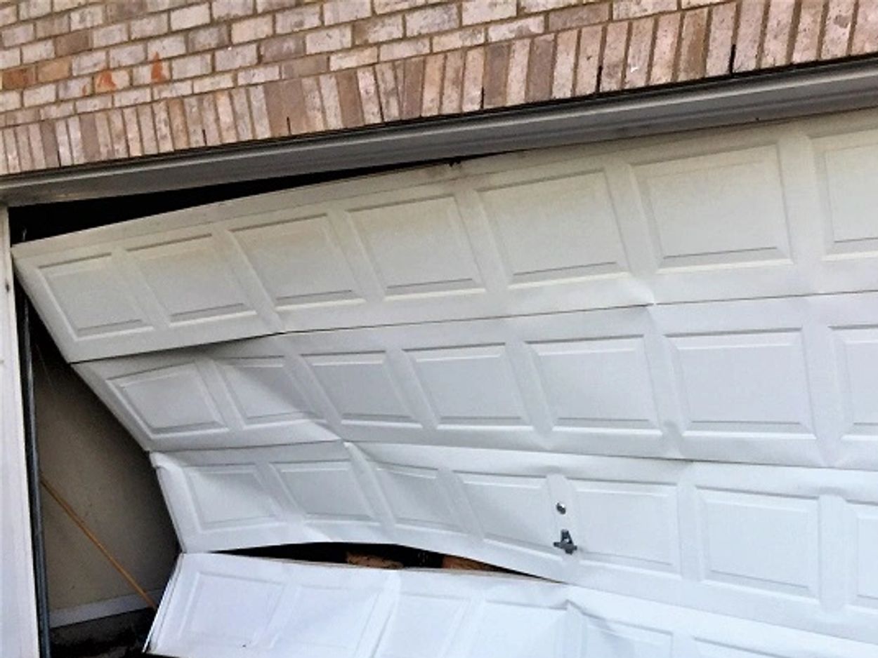 We replace garage door panels or sections