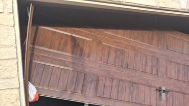 This is an exzample of a door off track. We were able to reassemble the damaged garage door. The cus