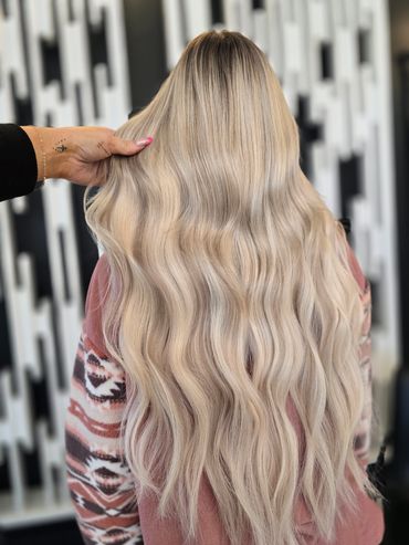 Long blonde hair extensions, flip up method. Human remy hair