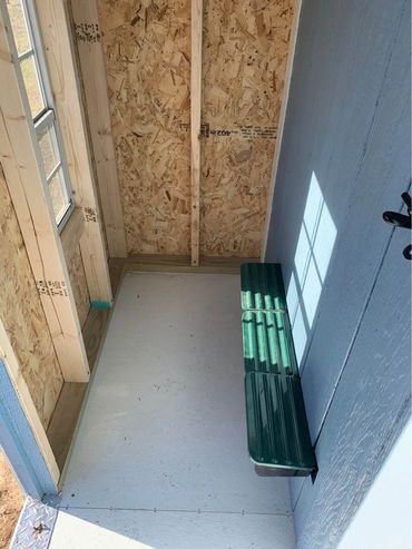 Optional storage area inside Cottage Coop with rollaway nest box.