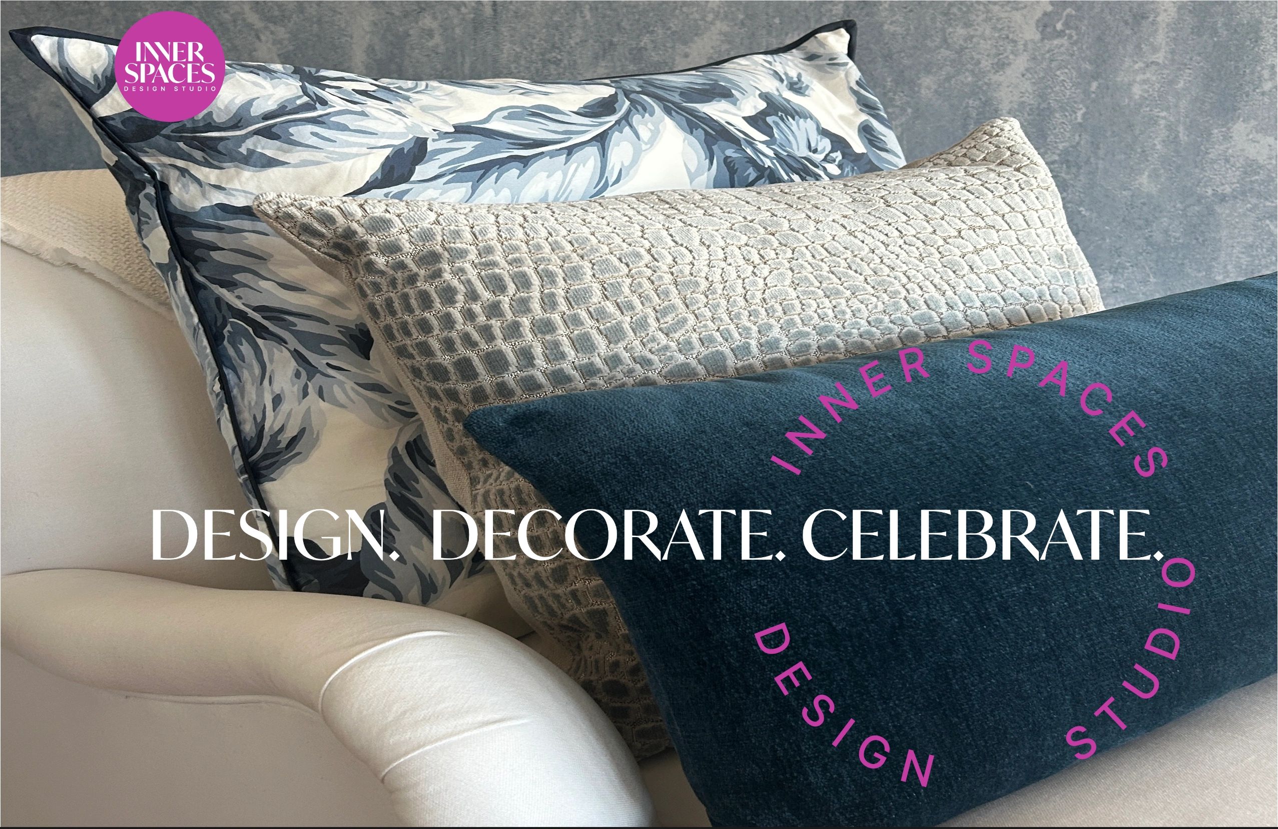 Elegant decorative pillows arranged on a white armchair with a textured wall background.