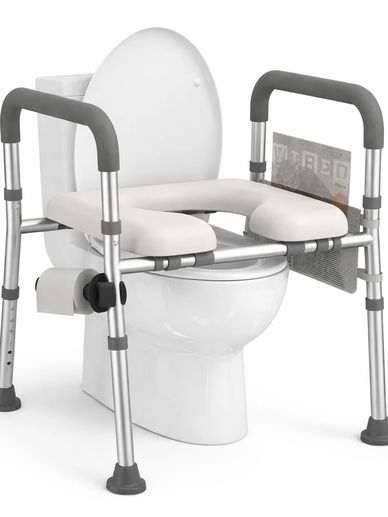 Raised toilet seat with armrests for elderly or disabled users.
