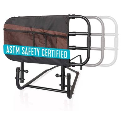 Black adjustable bed rail with ASTM safety certification label.