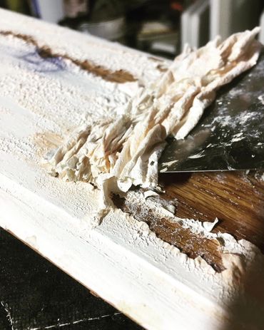 Painting "Latex" paint over previously stained wood is not a good idea for a quick fix!