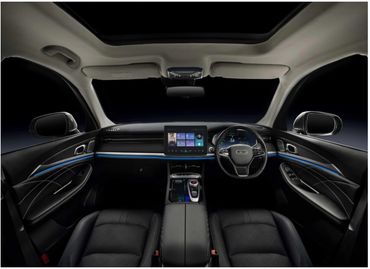 Modern car interior with digital dashboard and central touchscreen display.