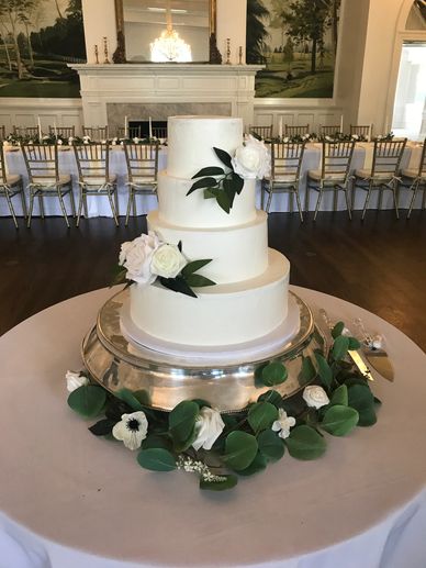 Traditional elegant 4 tier wedding cake can be customized from florals to multiple cake flavors.