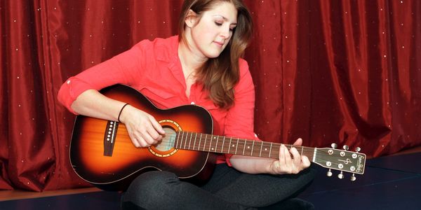 Picture of Tanya Lavoie, playing the guitar