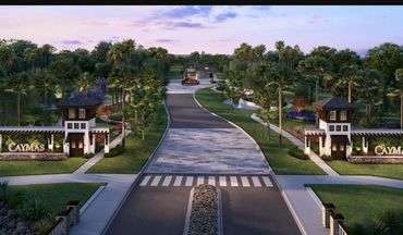 Caymas community entrance at dusk in Naples, FL