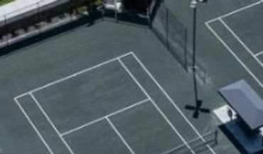 Aerial view of tennis courts at the Caymas Sports Center in Naples, FL