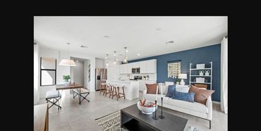 Open-concept kitchen and living area in a Sawgrass at Coral Lakes townhome, Cape Coral, FL