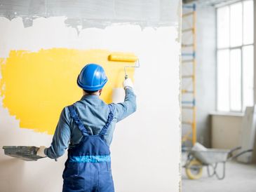 worker painting the wall