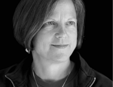 Black and white photograph of woman with short straight hair.