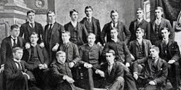 A vintage black-and-white photo of a group of men in formal attire.