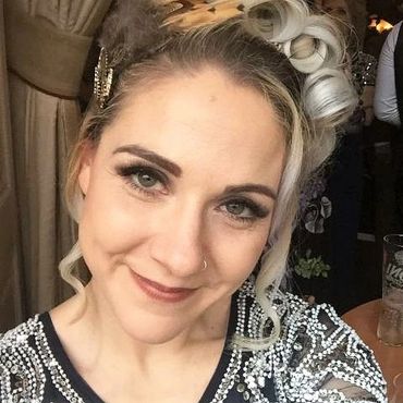 client wearing Russian lashes, UV lashes