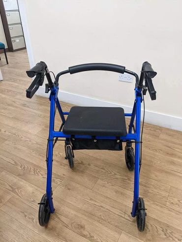Walker rollator with seat and storage £25 donation.