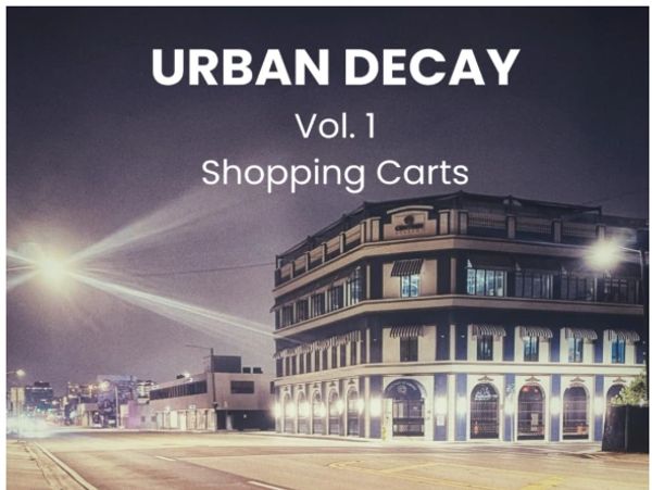 Abandoned shopping carts on an empty urban street at night.