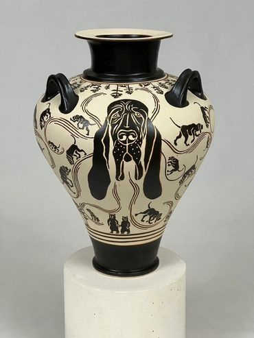 Black-painted piriform jar with three handles. Central image is the head of a Bloodhound dog,