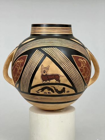 Squat, bulbous polychrome vase depicting Skye Terriers, badger, fox and otter.
