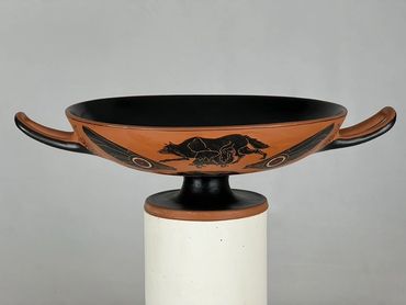 Black-figure Kylix depicting the Pekingese dog in a prehistoric scene.