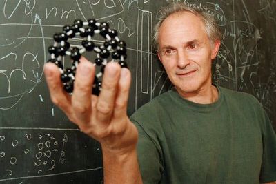 Sir Harold W. Kroto, Nobel prize winner,  with a model of Carbon 60.