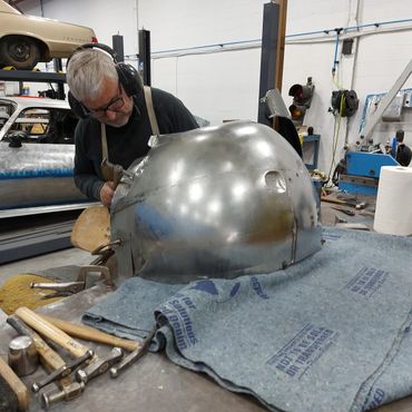 Turning flat sheets of metal in to a work of art... only to live life as an inner fender. 