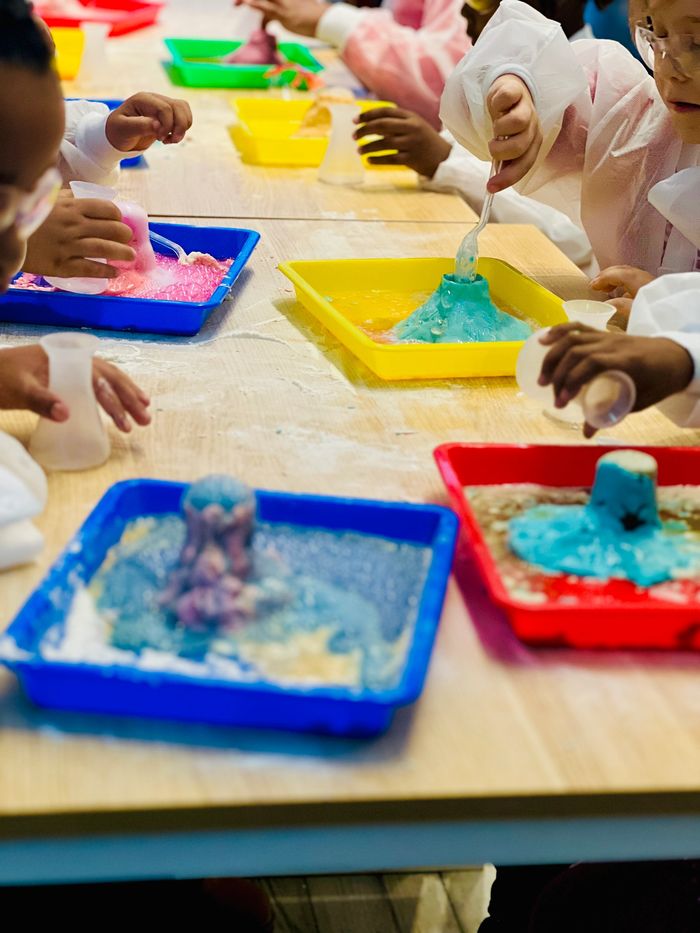 Volcano making with play dough and potions with acid and base.