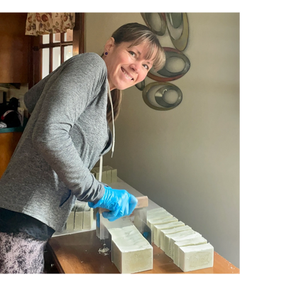 CIrcleLife founder, Cyndi Gauthier, hand-cutting a batch of  Double Butter Dream Soap.