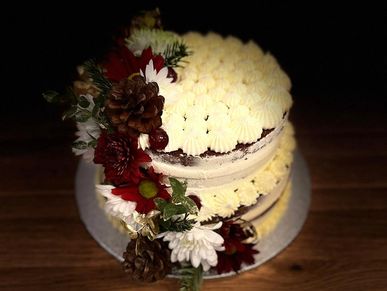 2 tier cake covered in whipped cream