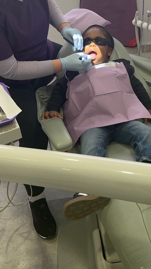 Child receiving gentle dental care at Sorriso Dental Care Kids Corner clinic
