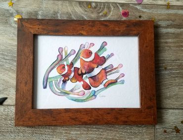 watercolor painting clownfish in anemone plant