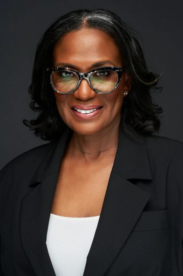 black woman wearing glasses studio portrait commercial model