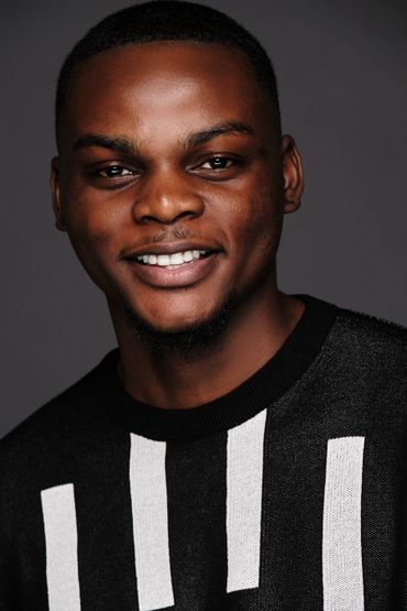 black male model white teeth studio portrait