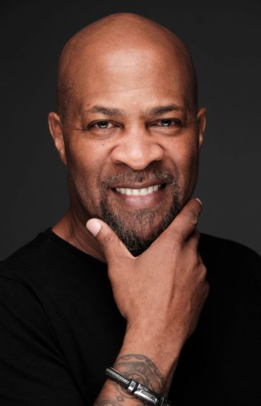 bald head Blackman black t-shirt smile actor Philly