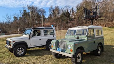Modern and vintage Land Rovers together 