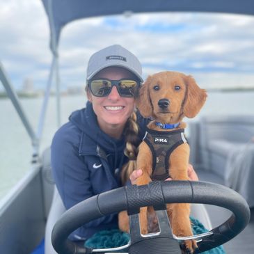 Captain Maggie driving with her new puppy