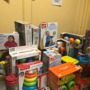 Pile of boxed baby toys and educational kits.