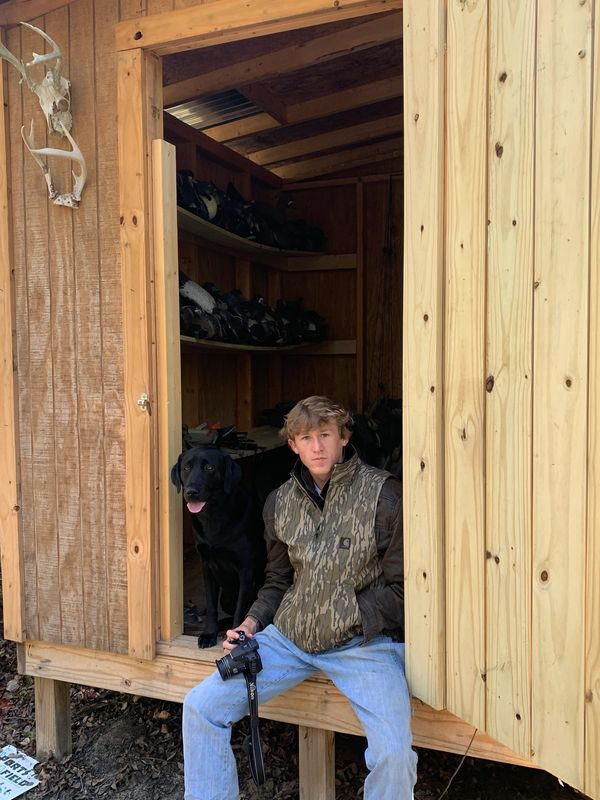Company Founder Will and Lab May hanging at the Duck Decoy Shack