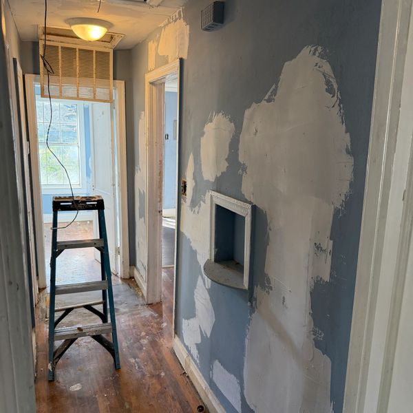 interior home hallway in the process of being sheetrock mudded and prepared for fresh paint.