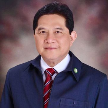 Professional portrait of a man in a suit with a striped tie.