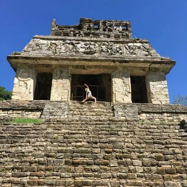 Karen Webb Green in sun warrior pose at the top of the Temple of the Sun pyramid, Palenque,