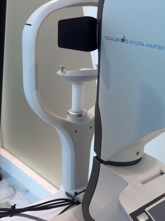 Oculus Myopia Master eye examination device with control panel.