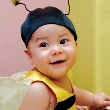 Baby dressed in a bee costume