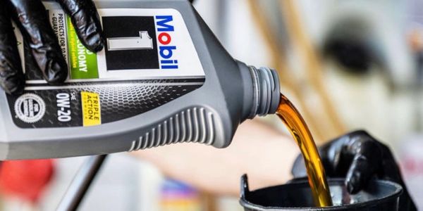 Mobil 1 motor oil being poured.